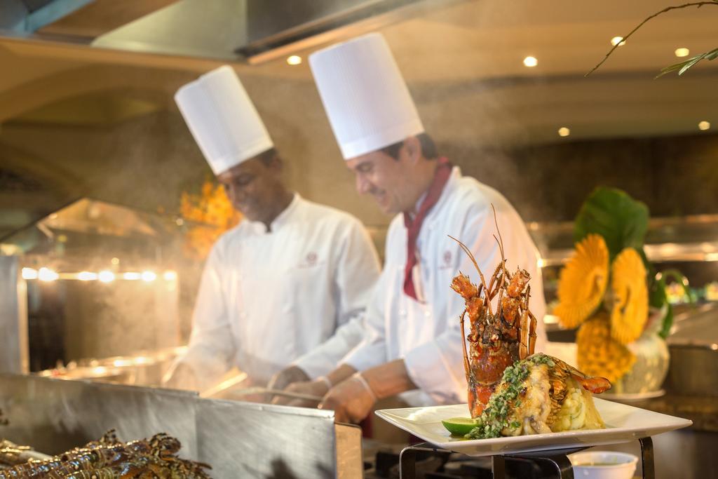 Majestic Elegance Punta Cana (Adults Only) Экстерьер фото Two chefs working in a hotel kitchen